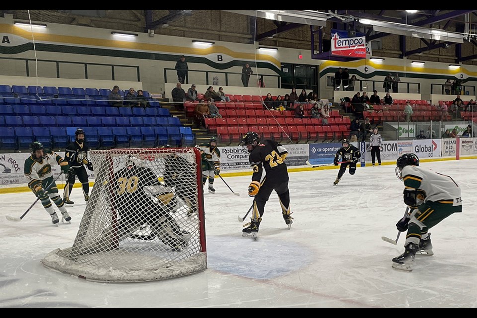 Kohen Louie [right] waits for a pass that would lead to his second of three goals in a 16-3 win for Powell River U13 Kings over North Island U13 Eagles at Hap Parker Arena on February 1. The following photos in the carousel show the puck in the back of the net.