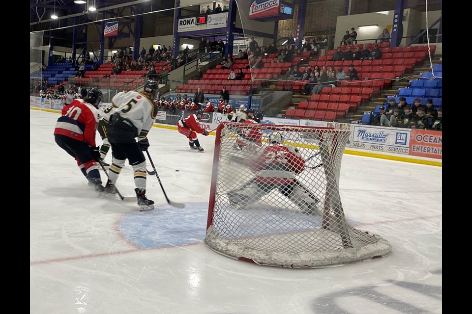 Powell River U18 Kings' forward Ben Belyea (19), gets ready to deflect a pass toward the Cowichan Valley U18 Capitals' net during a minor hockey playoff game at Hap Parker Arena on Sunday, March 2, as his teammate Beau Jameson Gagne (5) also approaches the crease. 