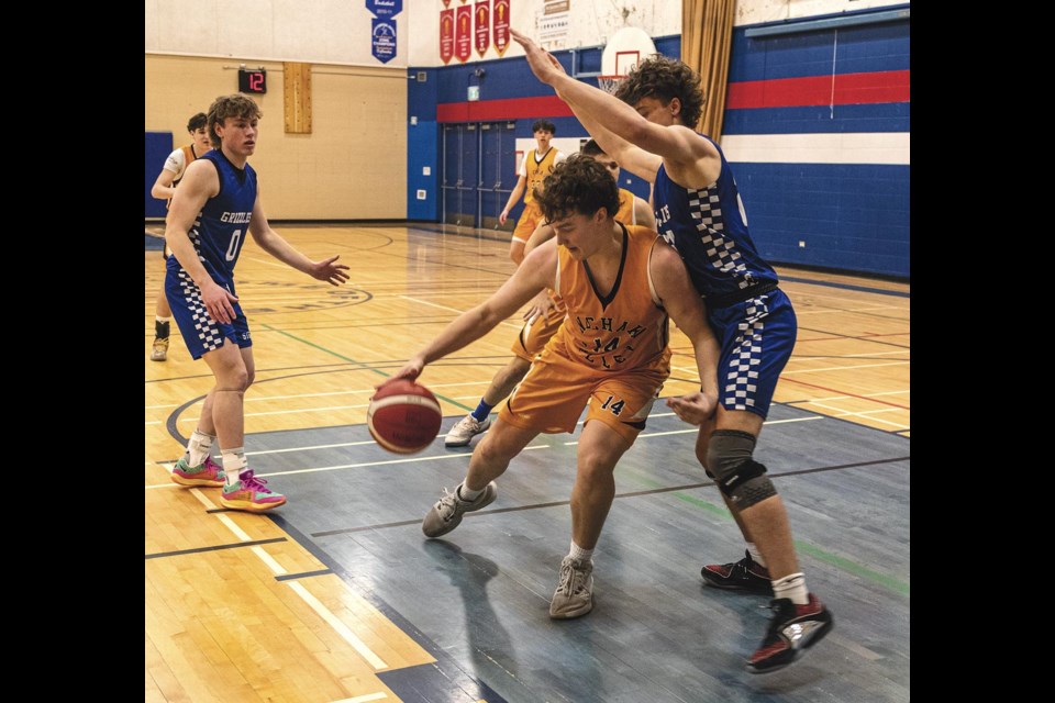 NVSS Viking Thomas Cross works around the guard of STKR Grizzly Teagen Vanegmond in their AA Basketball Zones game Thursday, Feb 20, 2025 at DP Todd Secondary School.