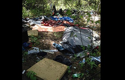 A homeless camp just off of Queensway is in the process of being removed. (via contributed)