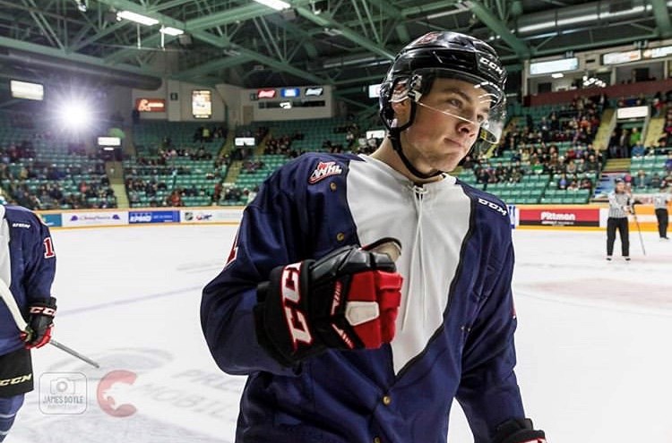 Josh Maser skates by his bench after scoring a goal against the Kelowna Rockets on Country Night (via Prince George Cougars/James Doyle Photography)