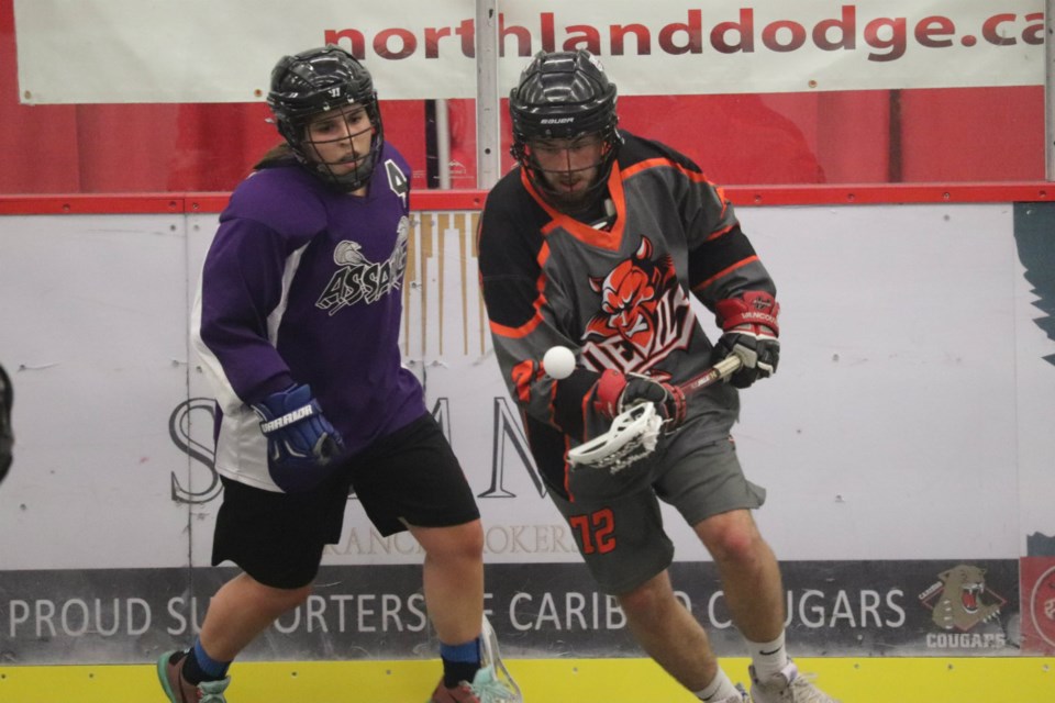 Andrew Schwab (#12) of the Devils controls the ball around Sera Sia (#4) of the Assault in Game Two of the 2019 Prince George Senior Lacrosse finals (via Kyle Balzer)