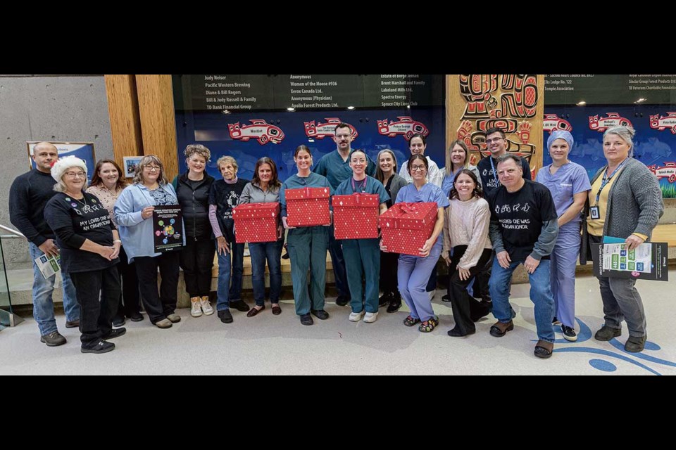 Critical care providers from the transplant clinic, operating rooms and Intensive Care Unit join with donor recipients and a donor family to celebrate the milestone of 11,000 organ transplants in BC with BC Transplants Operation Popcorn campaign at UHNBC Tuesday.