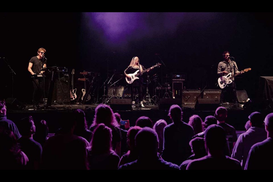 New Wave rockers Spoons (from left) Scott MacDonald (keyboards), Sandy Horne (bass), Chris McNeill (drums, not shown) and Gordon Deppe (guitar and vocals) opened the '80s Club show with a selection of their hits that had the crowd singing along Tuesday, Nov. 12, 2024 at CN Centre in Prince George.
