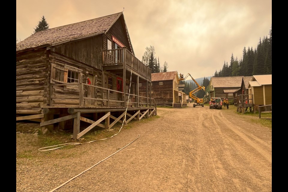 Crews worked to protect the historic wooden structures in Barkerville from the summer 2024 wildfires that threatened the pioneer museum village.