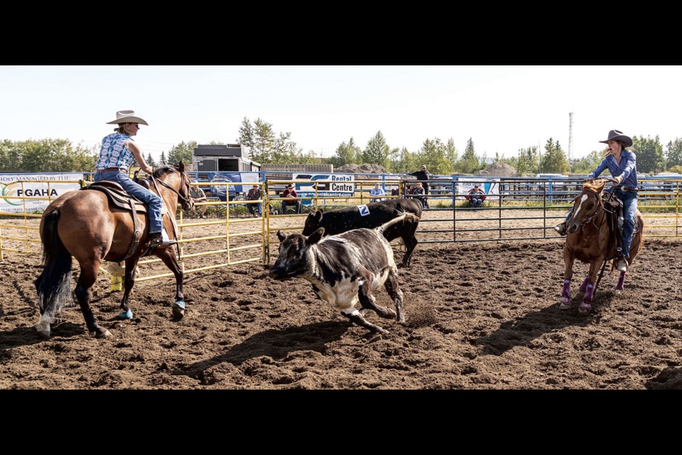 Julie Blackwell (left) and Rebecca Dahl take part in the Saddle Up N Sort competition at the BCNE Sunday.