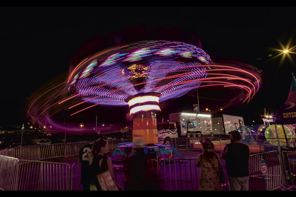 Kite Flyer takes riders on a whirling flight through the night at the BCNE Saturday evening.