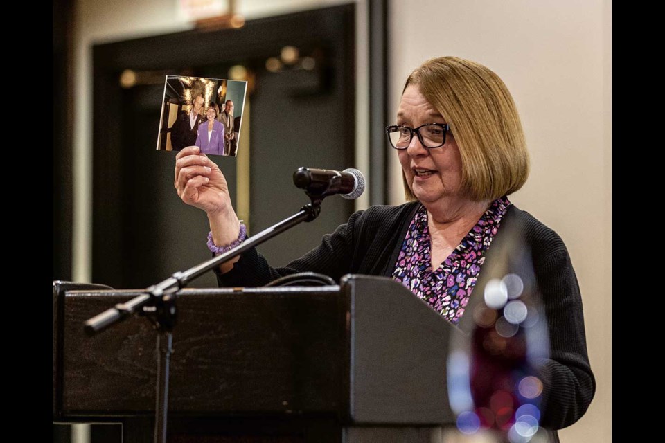 Shirley Bond holds up a picture of Bob Scott and herself in Victoria, taken after he received an award, during the 3rd Annual Bob Scott Award ceremony at the Coast Prince George Hotel on Thursday, Nov. 14, 2024.