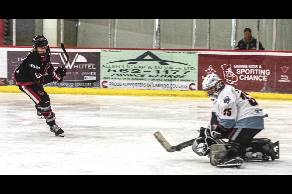 North West Hawks goalie Mowat Sweet stops a shot by Cariboo Cougars forward Rylan Bissett Sunday March 16 at Kin 1.