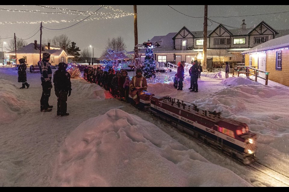 Visitors enjoy a train ride through the seasonally lit up grounds of the Central BC Railway and Forestry Museum Celebration of Lights.