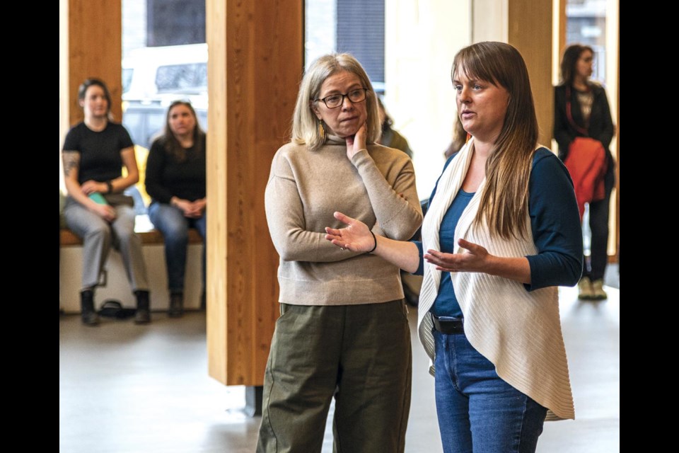 Brittny Anderson, Minister of Local government and Rural Communities, answers a question posed at the Wood Innovation and Design Centre in downtown Prince George Tuesday while Randene Neill, Minister of Water, Land and Resource Stewardship, listens.