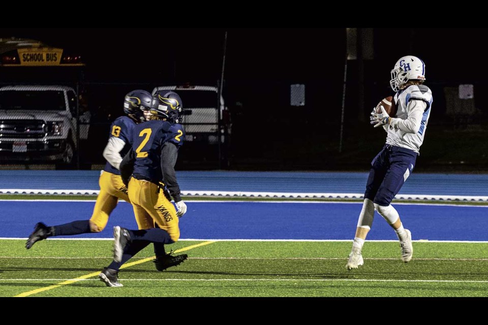 CHSS Cougar Alex Irvine #2 pulls the ball to his chest after catching a pass just prior to crossing into the endzone for the Cougars' first touchdown against NVSS Friday at Masich Place Stadium.