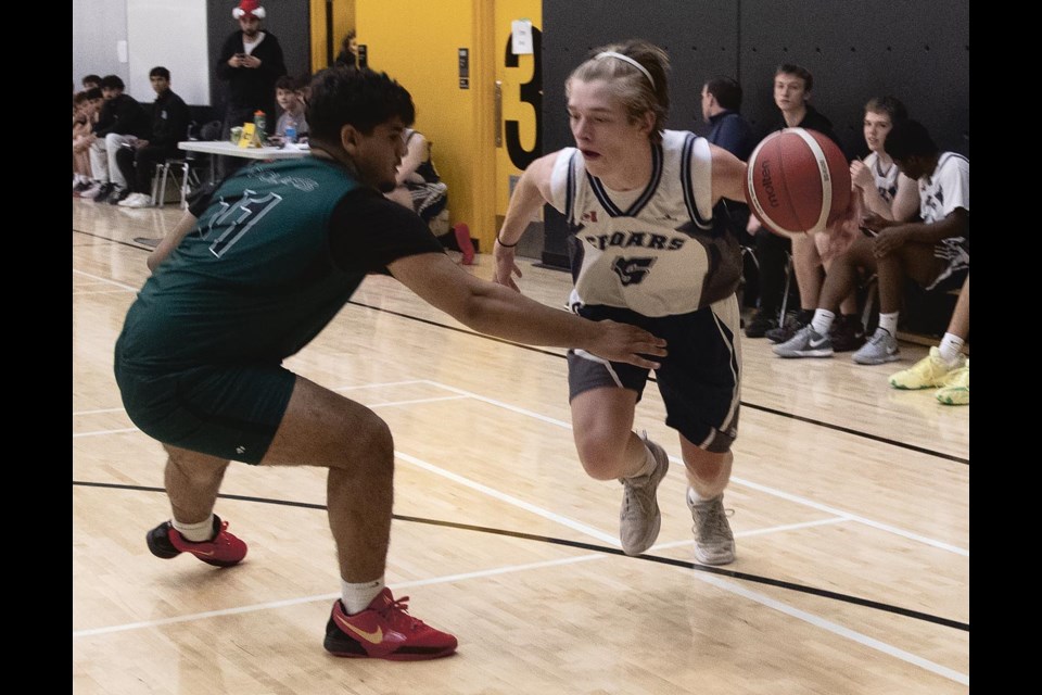 Cedars Eagles #5 Kaeden Paulsen drives around  PGSS Polars #11 Liam Reusch Friday at the Duchess Park Condor Classic.