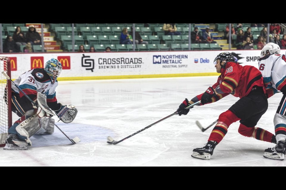 Cougars forward Borya Valis unleashes a shot that beats Rockets goalie Jake Pilon to take the lead 2-1 in the second period Wednesday Feb. 26 at CN Centre.