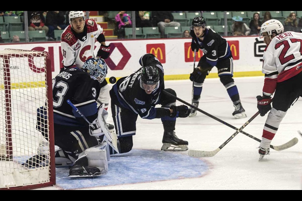 Cougar forward #27 Riley Heidt's shot bounces off of Royals goalie #33 Jayden Kraus during Saturday's 5-4 shootout loss at CN Centre.