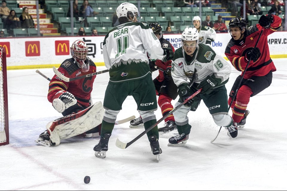 Silvertips forward Zackary Shantz chases down the puck after it is turned aside by Cougars goalie Josh Ravensbergen on Saturday, Feb. 15, 2025 at CN Centre.