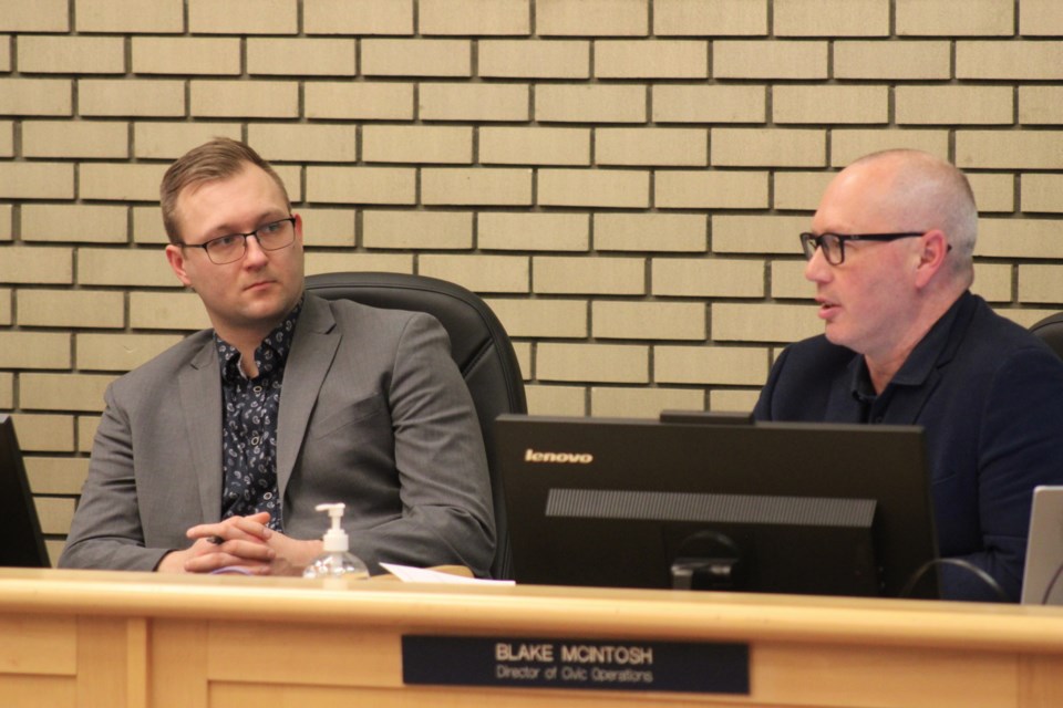 Director of civic operations Blake McIntosh (right) discusses the City of Prince George's snow control policy at the Monday, Feb. 24, 2025 city council meeting as director of administrative services Eric Depenau (left) looks on.