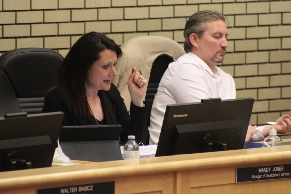 Manager of development services Mandy Jones (left) discusses a rezoning bylaw for 9153 Twinberry Dr. at the Monday, March 10, 2025 meeting of Prince George city council.