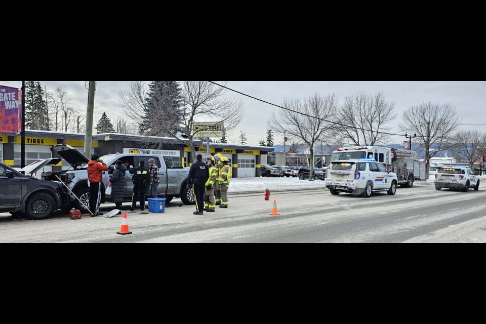 City firefighters and RCMP officers work at the scene of a collision on 20th Avenue at Spruce Street at midday on Friday, Feb. 7, 2025 in Prince George, BC.