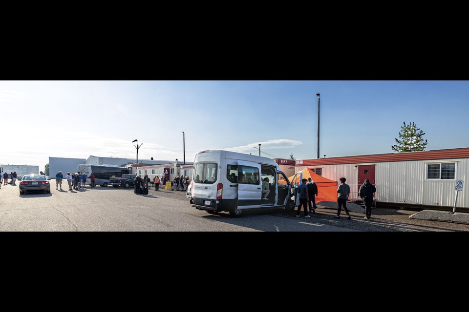 Evacuees from the Jasper wildfires arrive at the Prince George emergency centre at Exhibition Park Tuesday morning.