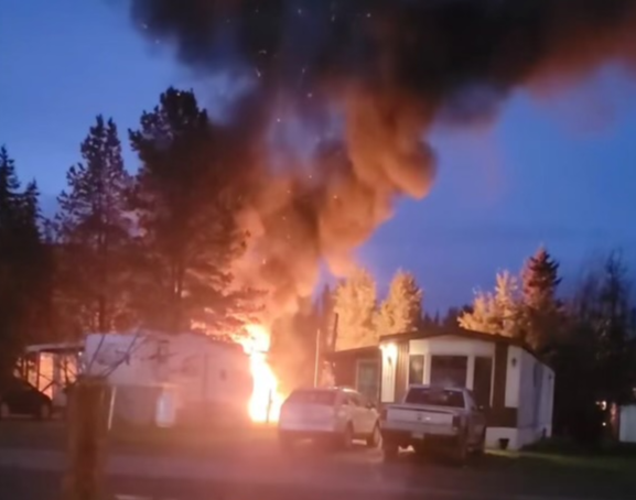 A trailer goes up in flames early Tuesday, Sept. 24 is seen at the Sintich RV Park in Prince George, BC.