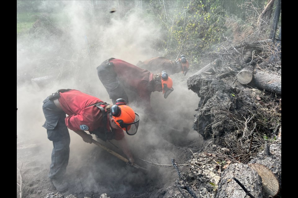 Crews work at slowing the spread of a wildfire in this file photo. Similar efforts are currently underway at Ancient Forest/Chun T'oh Whudujut Park.