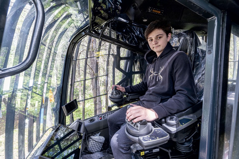 Hans-Loic Fuhrer, 15, has been working with his family's harvesters and forwarders since he was 12 years old.