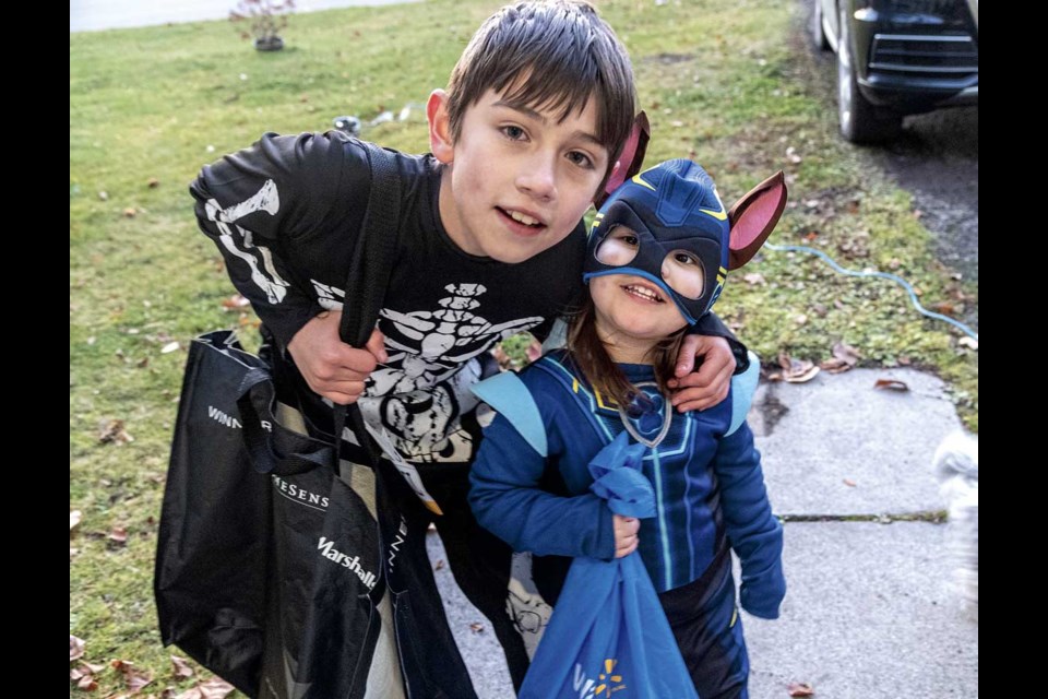 Isaiah Young, 10, and his sister Esme, 2, stopped by to say "Trick or Treat" before leaving with a "Happy Halloween" to start All Hallows Eve Thursday night.