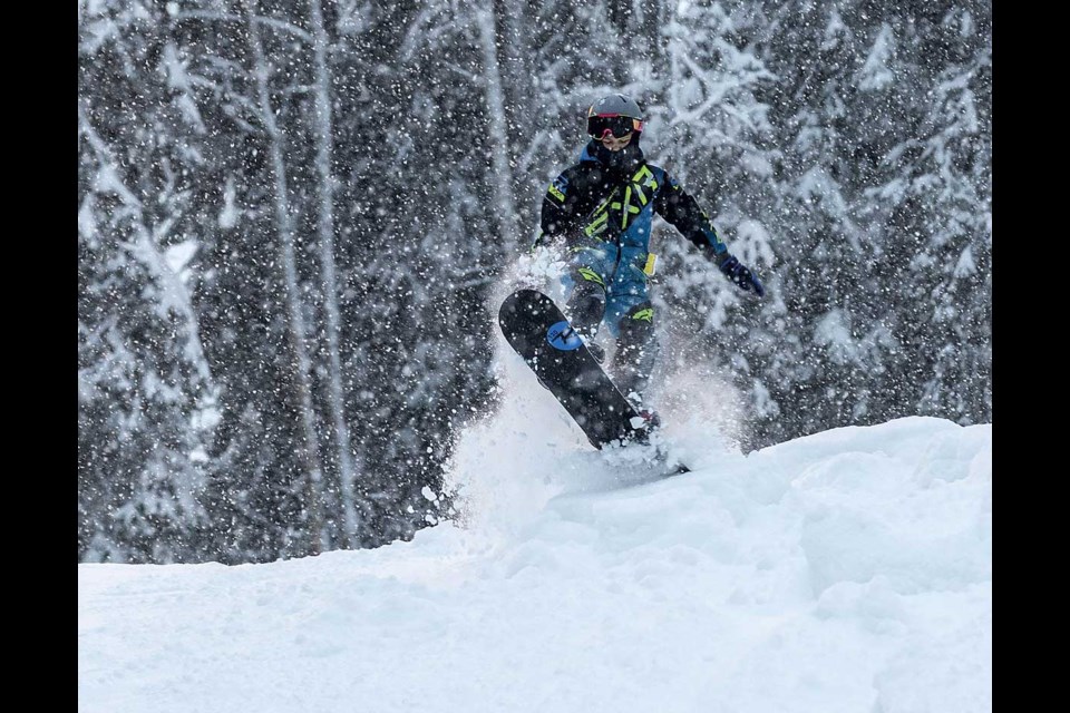 Harlan Roe, 11, gets some air as he tries some of the fresh powder on the slopes at Hart Ski Hill Saturday on the first day of operations for the season.