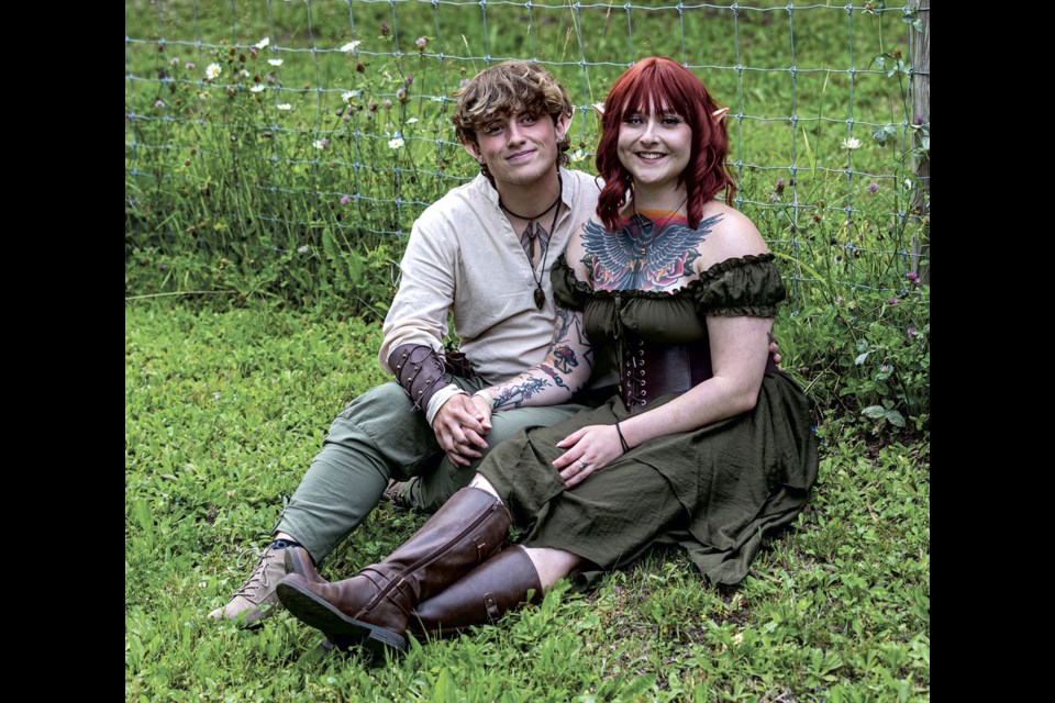 Xander Mitchell and Mackenzie Matthews take time out from their elven revels while taking part in An Evening of Enchantment at Hunniford Gardens Friday evening. 