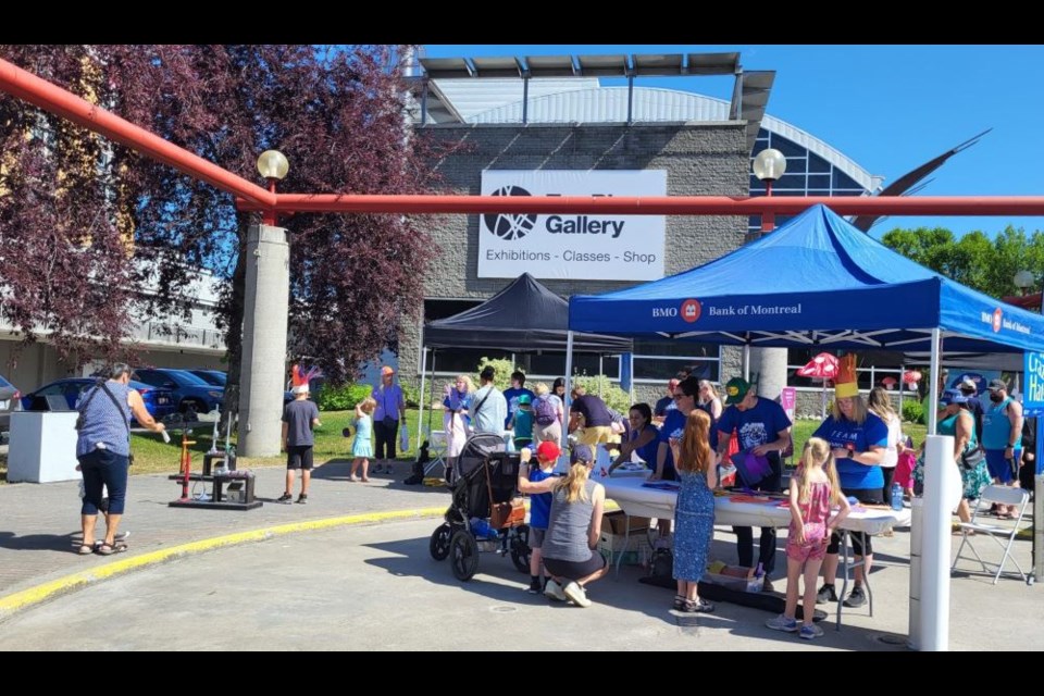 There's a bit of a crowd at the crazy hats and paper rocket launcher at the BMO Community Arts Days are going right now - Friday - until 3 p.m. and Saturday, July 13 from 10 a.m. to 3 p.m. 