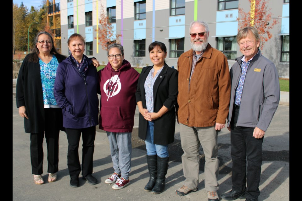 The Aboriginal Housing Society of Prince George unveiled Phase 3 of its urban aboriginal residential community, a 35-unit apartment complex T 1919 - 17th Ave., geared to elders at risk of homelessness. On hand for the open house event Thursday were, from left, Ruby Baptiste, chair of the Aborginal Housing Society of Prince George; Lheidli T'enneh First Nation elder Darlene McIntosh; Aboriginal Housing Society directors Samantha Moise and Tamatha French, BC Housing non-profit portfolio manager David Sheach; and city councillor Murry Krause.