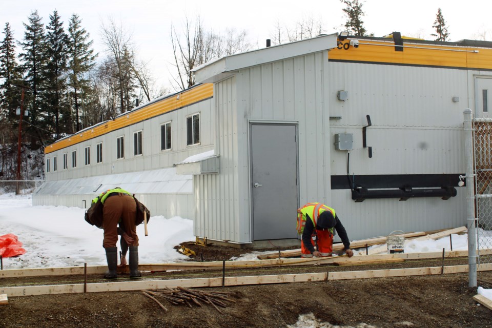 Workers take measurements for the foundation before they pour concrete for a walkway at BC Housing new downtown Prince George homeless shelter at 397 Third Ave. The shelter is slated to open Monday, Dec. 16.