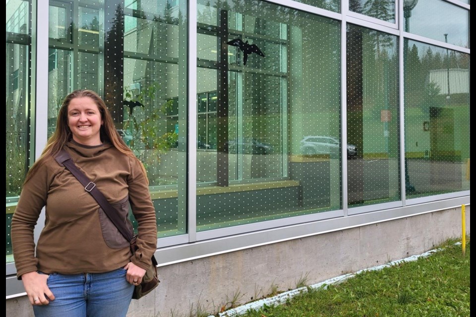 UNBC PhD student Jeannine Randall was instrumental in getting this polka- dot film applied to a glass corridor at the university to prevent bird strikes. It has eliminated the problem.