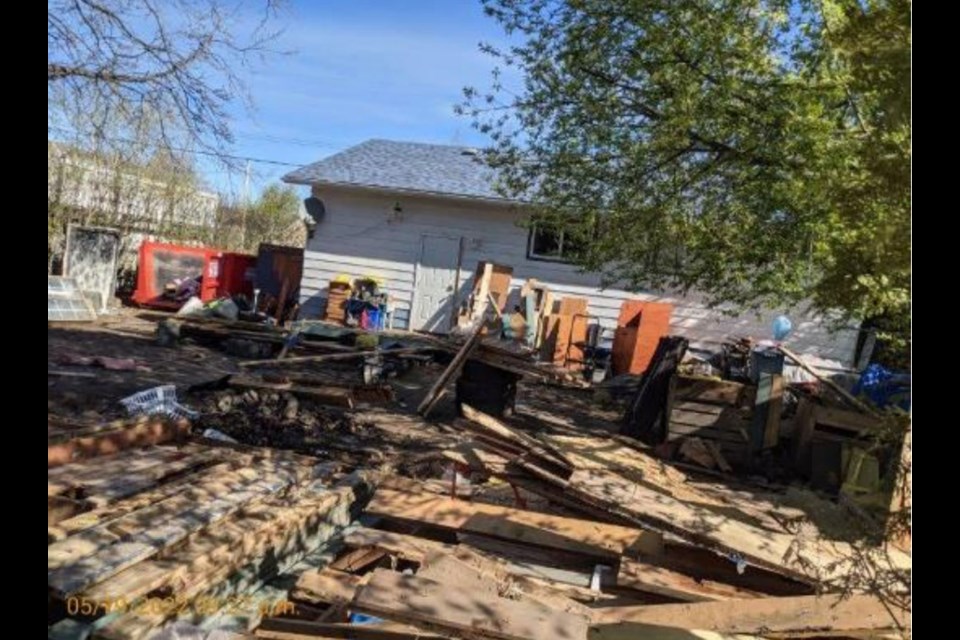 Debris in the yard of a home at 2677 Vance Rd. is seen in photo included in a report going before city council on Monday.