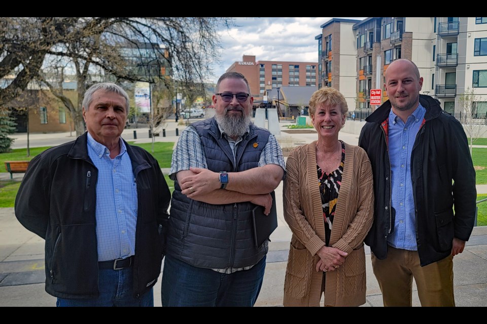 Downtown Prince George board members, from left. Kirk Gable, Derek Dougherty, Colleen Van Mook and Eoin Foley gathered at city hall after making a group presentation to city council and staff at a May meeting.