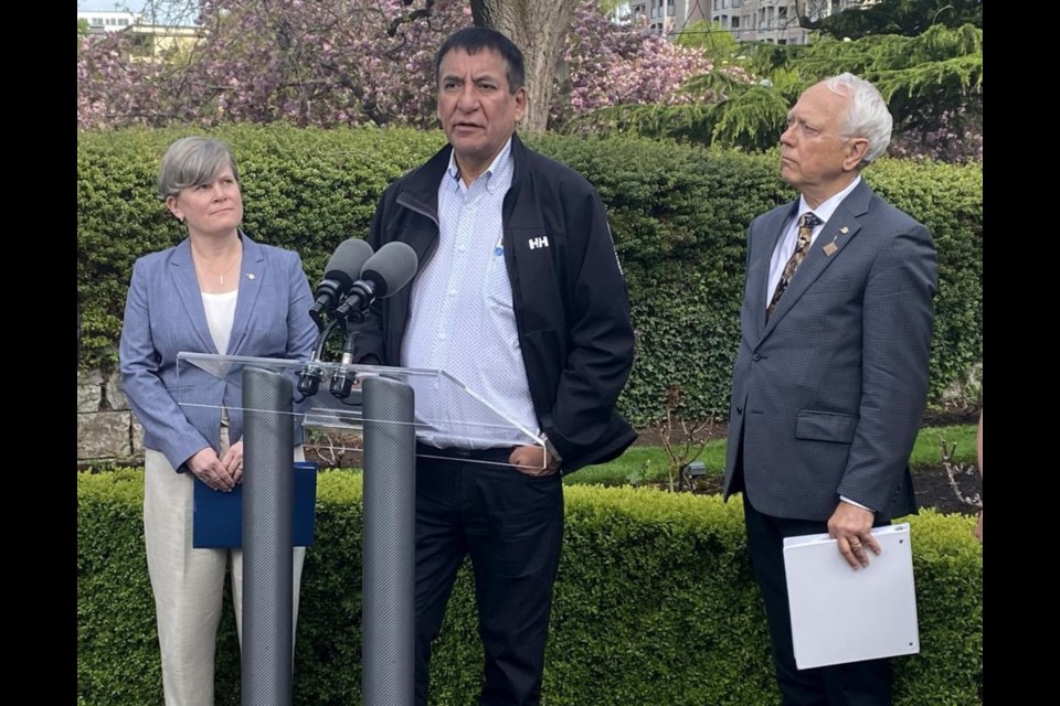 McLeod Lake Indian Band Chief Harley Chingee talks to media in Victoria, B.C., Wednesday, May 3, 2023, as Indigenous Relations and Reconciliation Minister Murray Rankin and Josie Osborne, energy, mines and low carbon innovation minister, look on. 