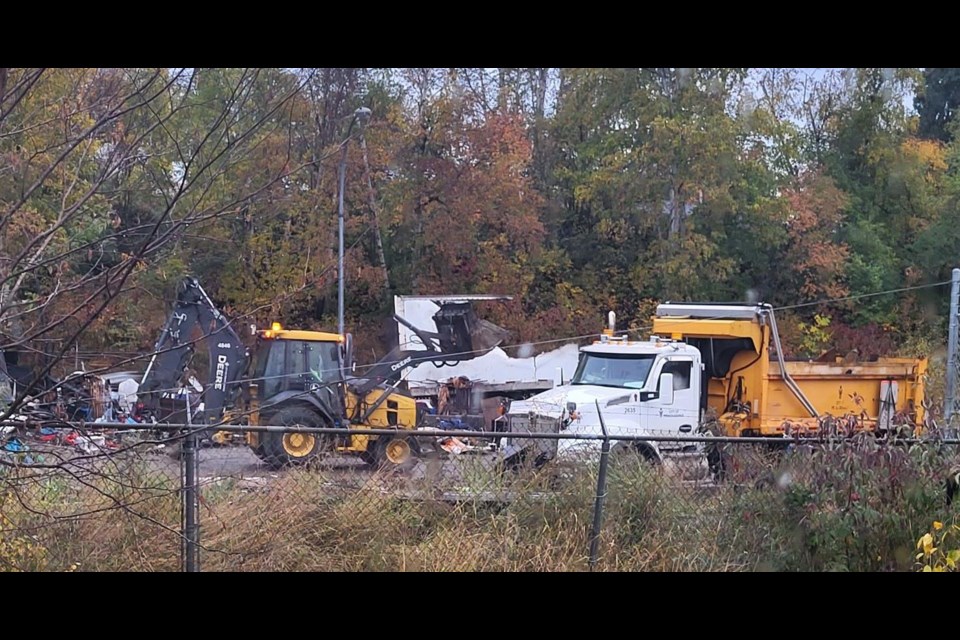 The city clears debris from the Moccasin Flats burned-out trailer site on Wednesday, Oct. 2, 2024