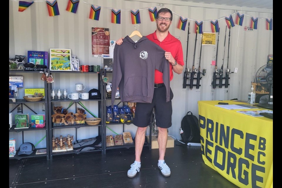 Colin Carson, Tourism Prince George CEO, shows off some new swag at the container at Canada Games Plaza.