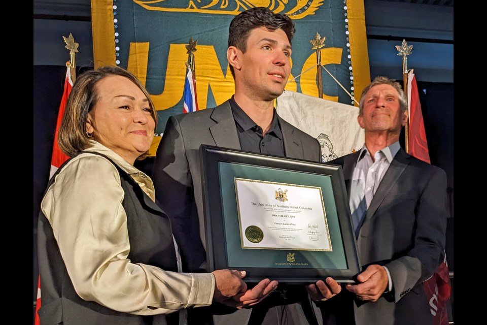 Flanked by his parents Lynda and Jerry, Montreal Canadiens goalie Carey Price receives an honourary Doctor of Laws degree at Friday's UNBC convocation at the Northern Sport Centre.