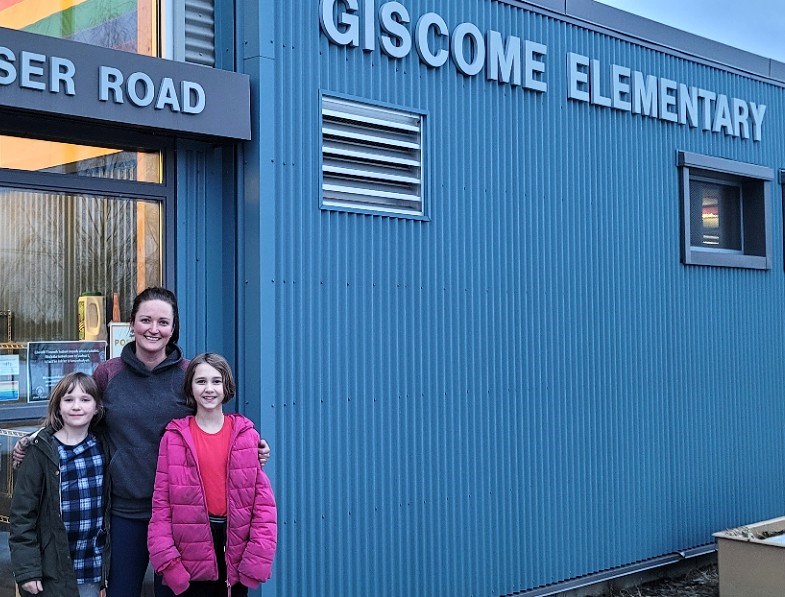 Danielle Malais and her daughters eight-year-old Cooper, left, and 10-year-old Hadley, don't want to leave Giscome Elementary School but with only 10 students and the student population expected to drop, they have no choice but to switch to a larger school in Prince George. SD 57 staff  and school trustees met with parents at the school Monday night (March 10, 2025) to discuss a proposal to close Giscome as of June 30.