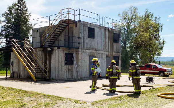 New suppression firefighter recruits hired by Prince George Fire Rescue learn how to fight a building fire at a training facility in Quesnel.