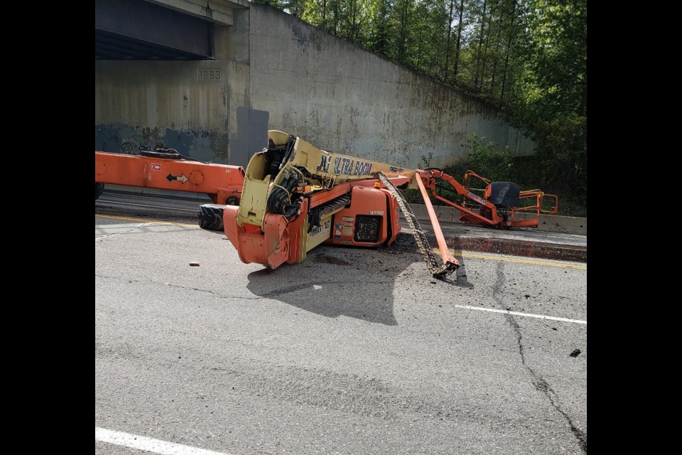 Laura MacDonald took this photo of a boom lift crane that was knocked off its trailer when it hit the bottom of the CN Rail bridge at Foothills Boullevard Saturday afternoon.