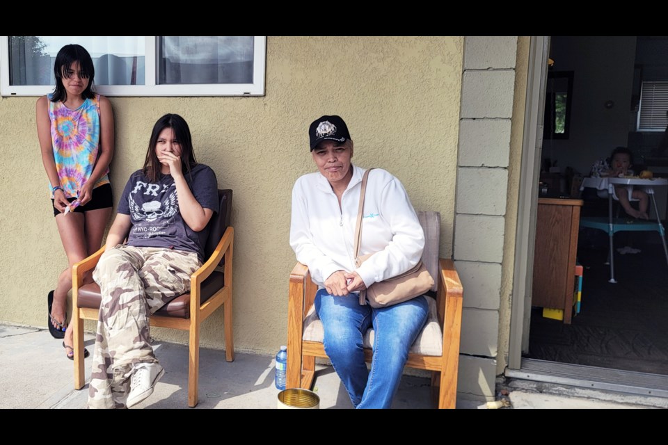 Victoria Joseph and two of her granddaughters, Raina Joseph, 12 (far left), and Ciara Cauchier, 14, are among the 180 people of Yekooche who have been forced to leave their homes in their village 80 km northwest of Fort St. James, due to wildfires.