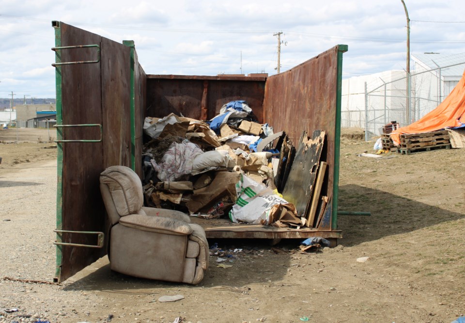 Moccasin Flats Trash container getting filled