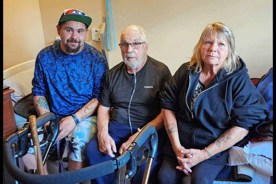 Thirty-year military veteran Leigh Delleavey, flanked by his grandson, Austin Ramsay, and his daughter, Della, drove with them in their truck from Prince George to Moncton, N.B., to get to the care home where he now resides. 