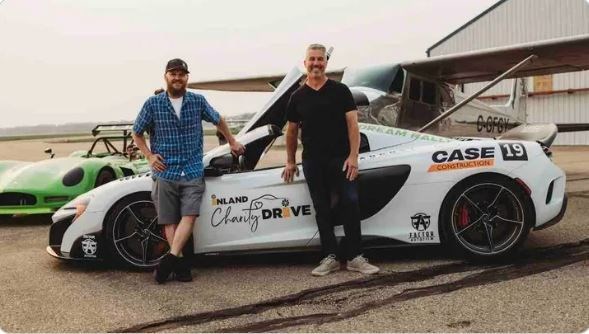 David Robertson, left, stands next to Brent Marshall, who made the trip from Kelowna to allow Robertson to drive Marshall's McLaren sports car at 300 kph on the closed runway at Red Deer Airport in September. It was a wish come true for Robertson, a Prince George native, who has since died of cancer. 