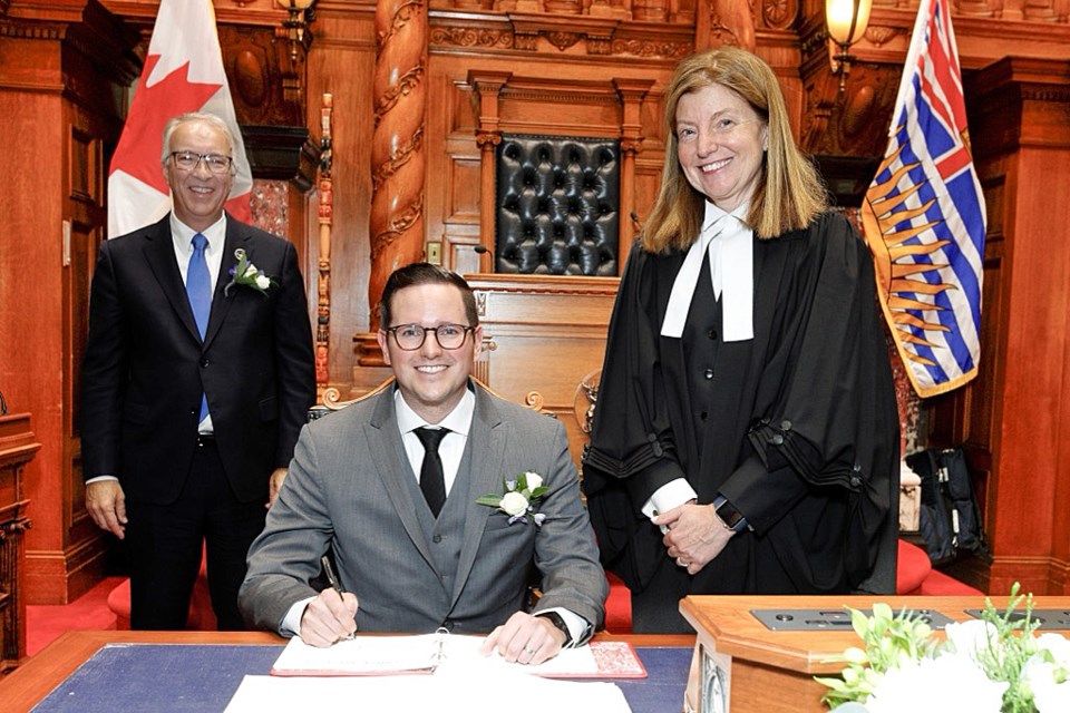 Kiel Giddens is sworn in as MLA for Prince George-Mackenzie by Legislative Assembly clerk Kate Ryan-Lloyd, witnessed by Conservative leader John Rustad on Nov. 12 in Victoria.