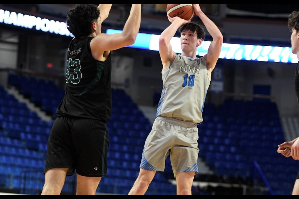 Dover Bay's Frank Linder measures a jumper against Prince George Polars' Rvnoor Thandi during B.C. quad-A senior boys basketball championship opening round March 5, 2025 at the Langley Events Centre's Arena Bowl.