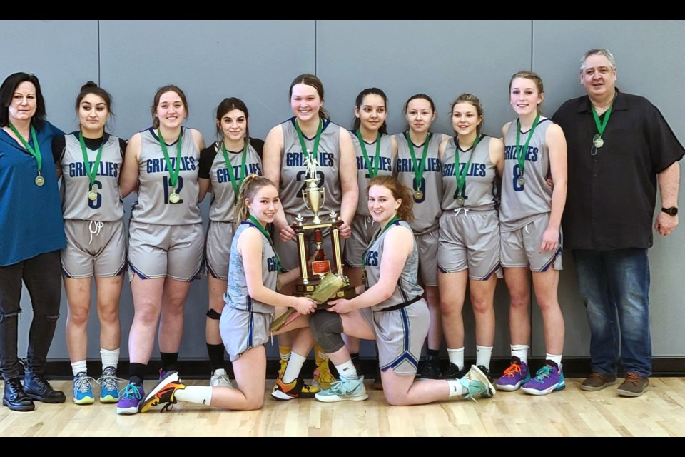 The Shas Ti Kelly Road Grizzlies celebrate winning the North Central zone double-A girls basketball championship for the first time  in the school's history since 1991.